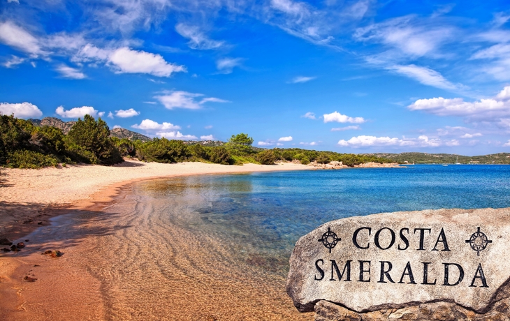 Sandy beach and blue sea at Costa Smeralda with clear sky.